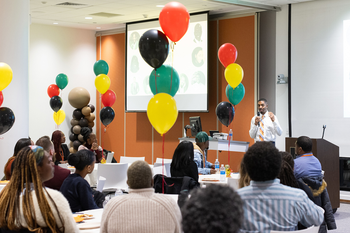 An alumnus gives career advice to students.