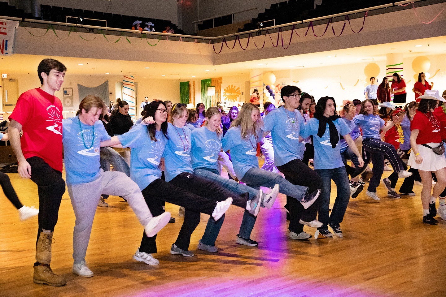 Row of people dancing together