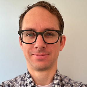 man in glasses smiling