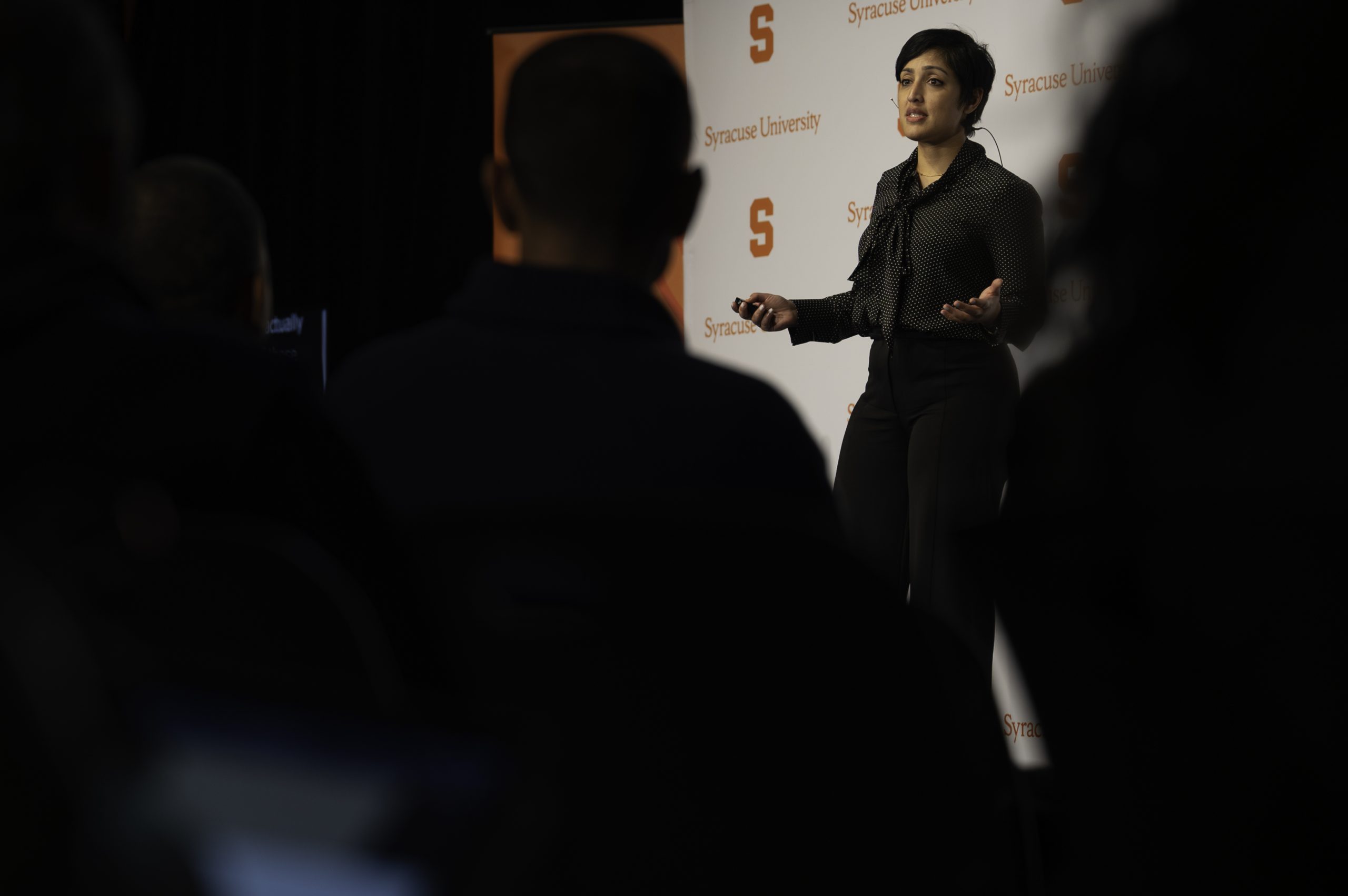 Woman speaking to an audience. 