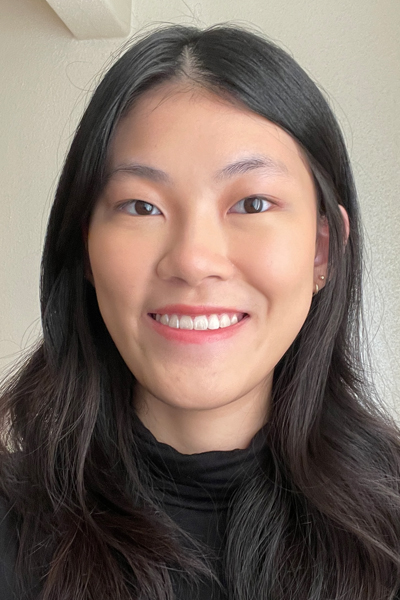 A woman smiles while posing for a headshot.