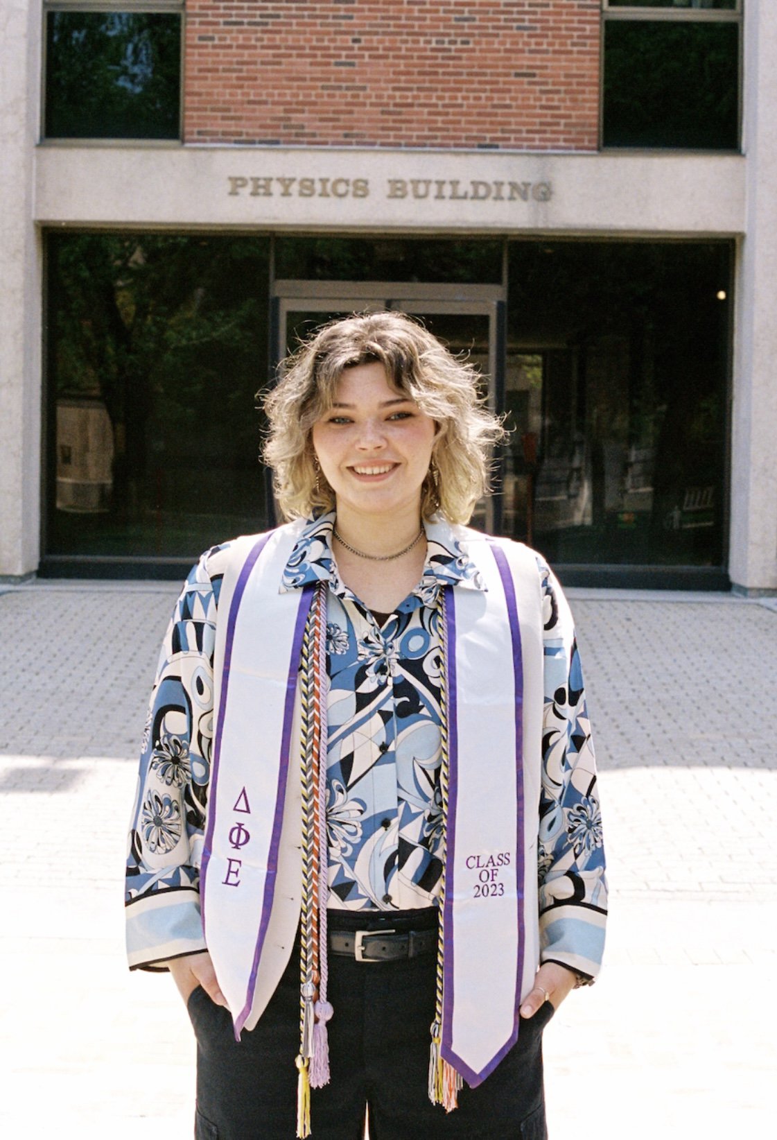 person standing outside Physics Building