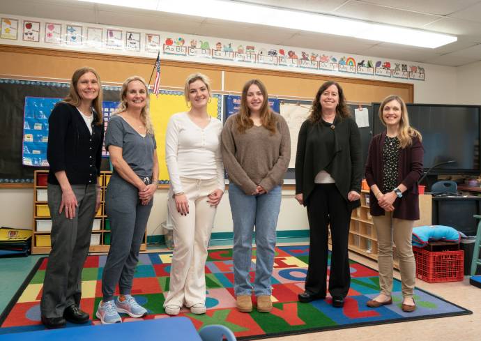 Falk College team teaching Mindfully Growing lessons at Elbridge Elementary School.