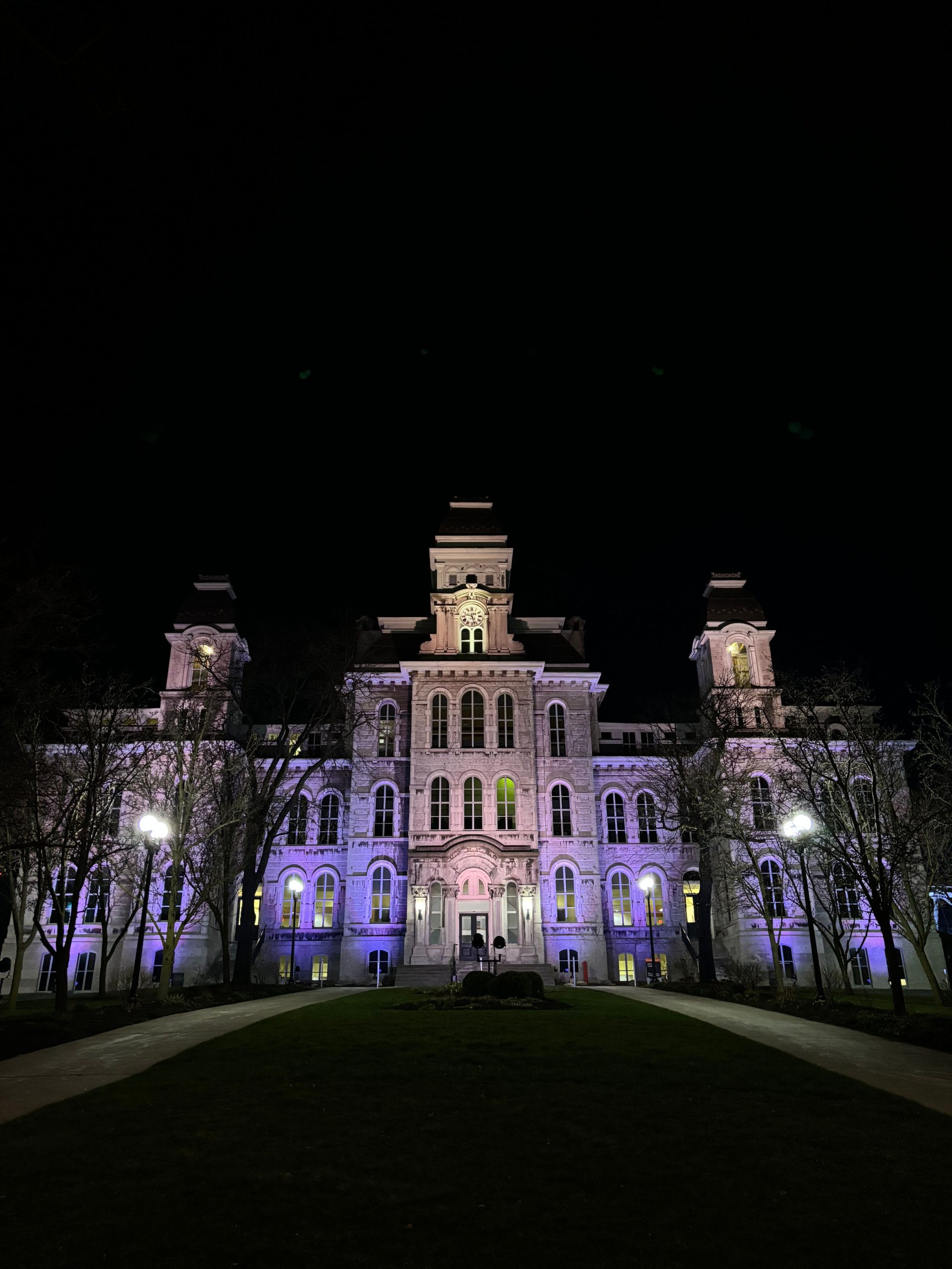 Hall of Languages at night illuminated in purple