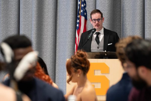 Person standing at a podium speaking