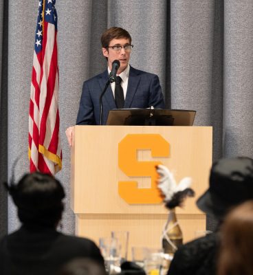 Person standing at a podium speaking