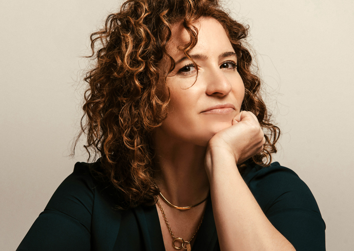 A woman poses for a headshot.