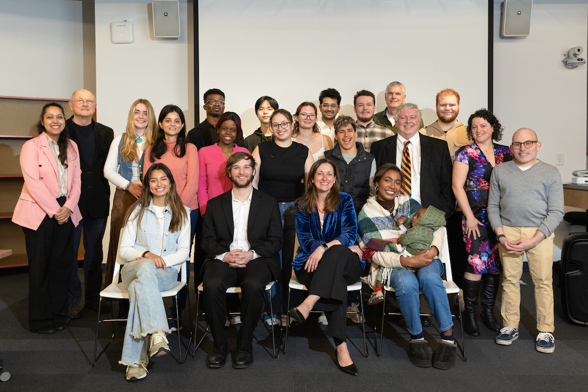 Large group of people sitting together for a photo