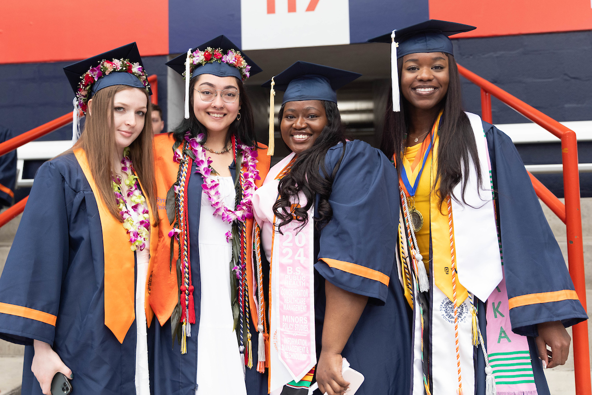 Four students standing together for a photo