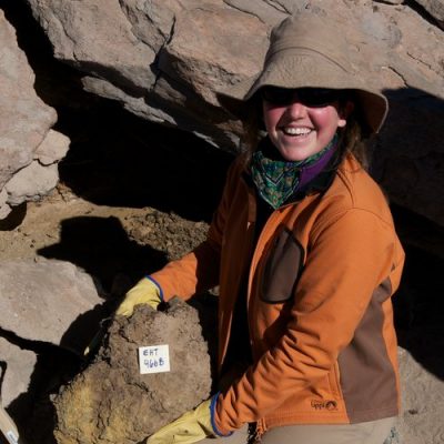 Researcher holding an ancient midden