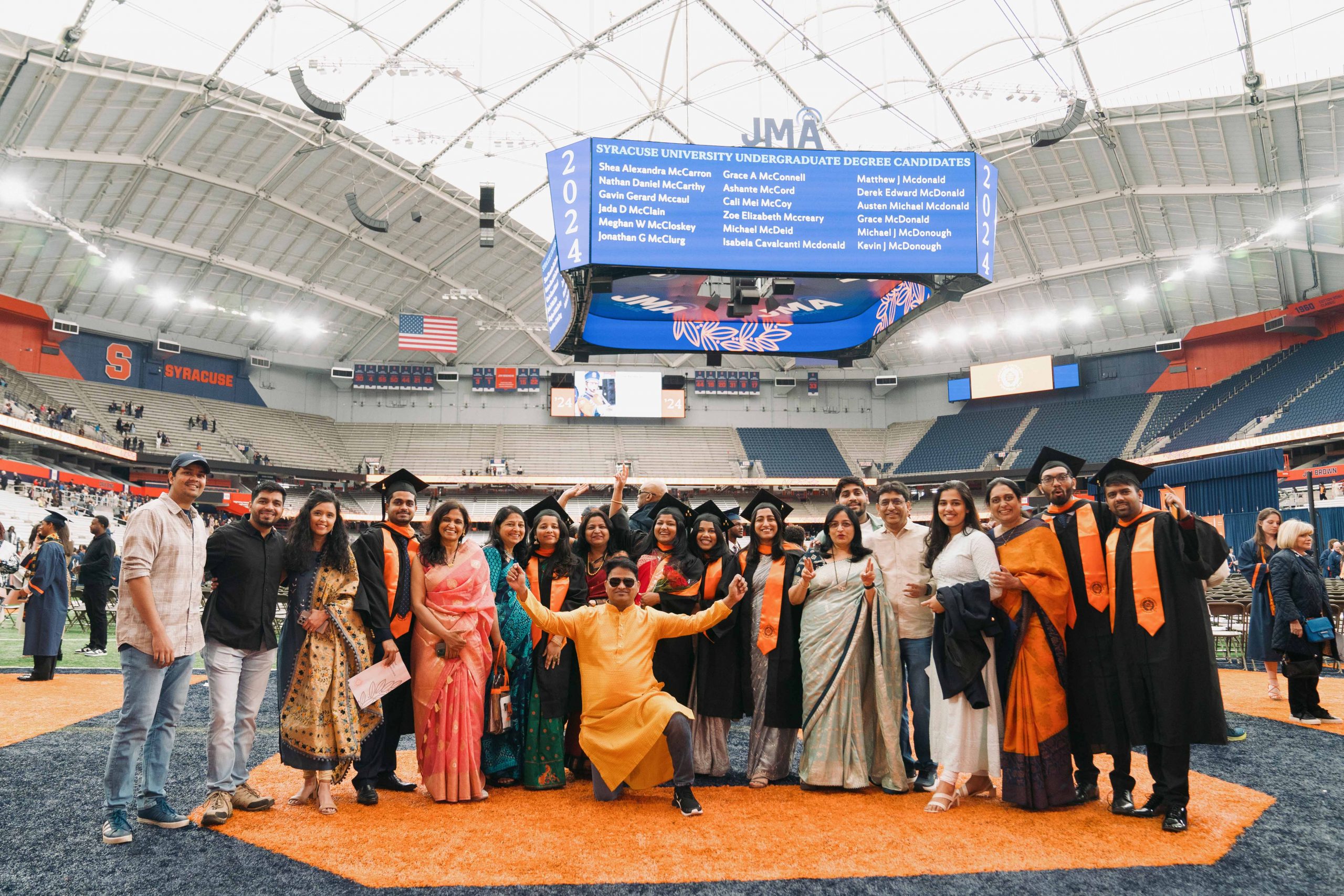 Large group of students posing together after Commencement 