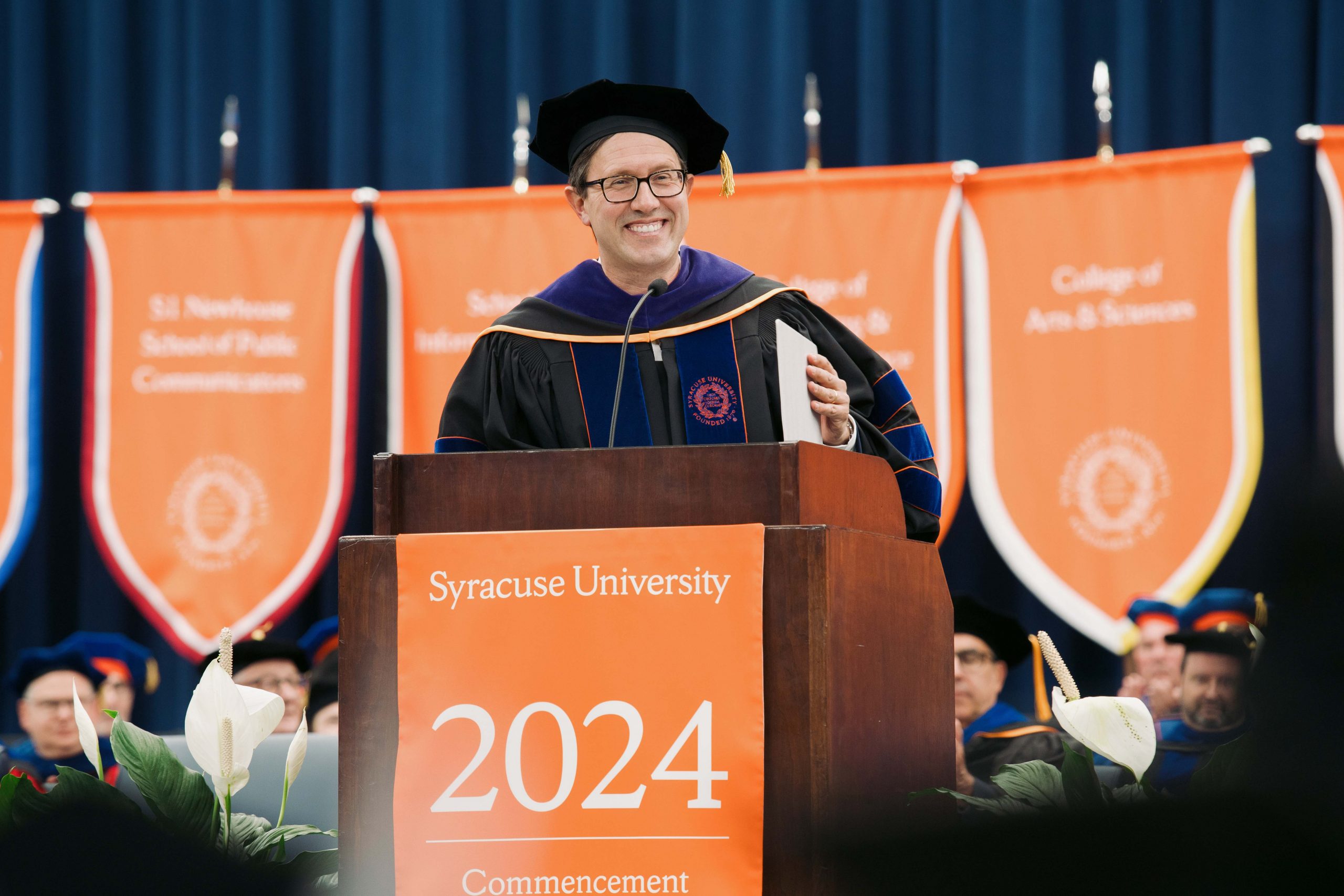 Person standing at the podium speaking during Commencement 