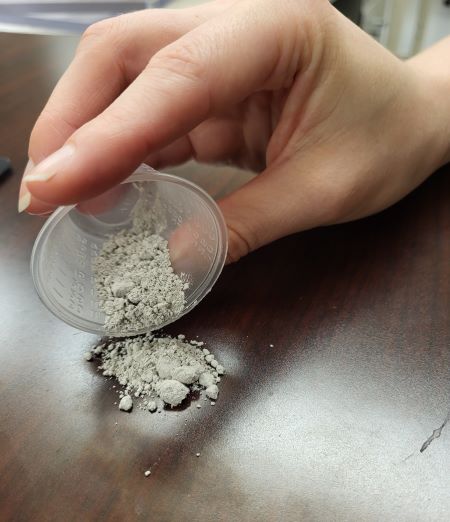 cup of ash-like material