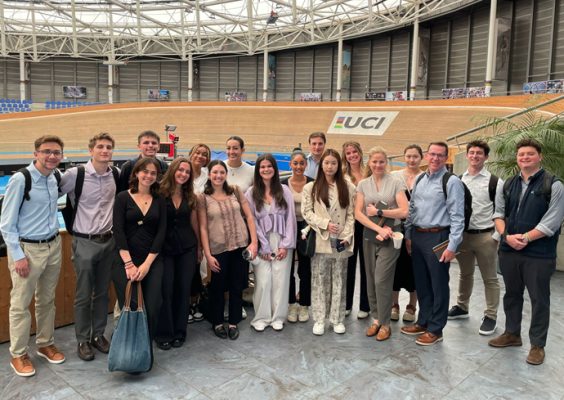 Students pose on the floor of the United Cycling Institute's headquarters in Switzerland.
