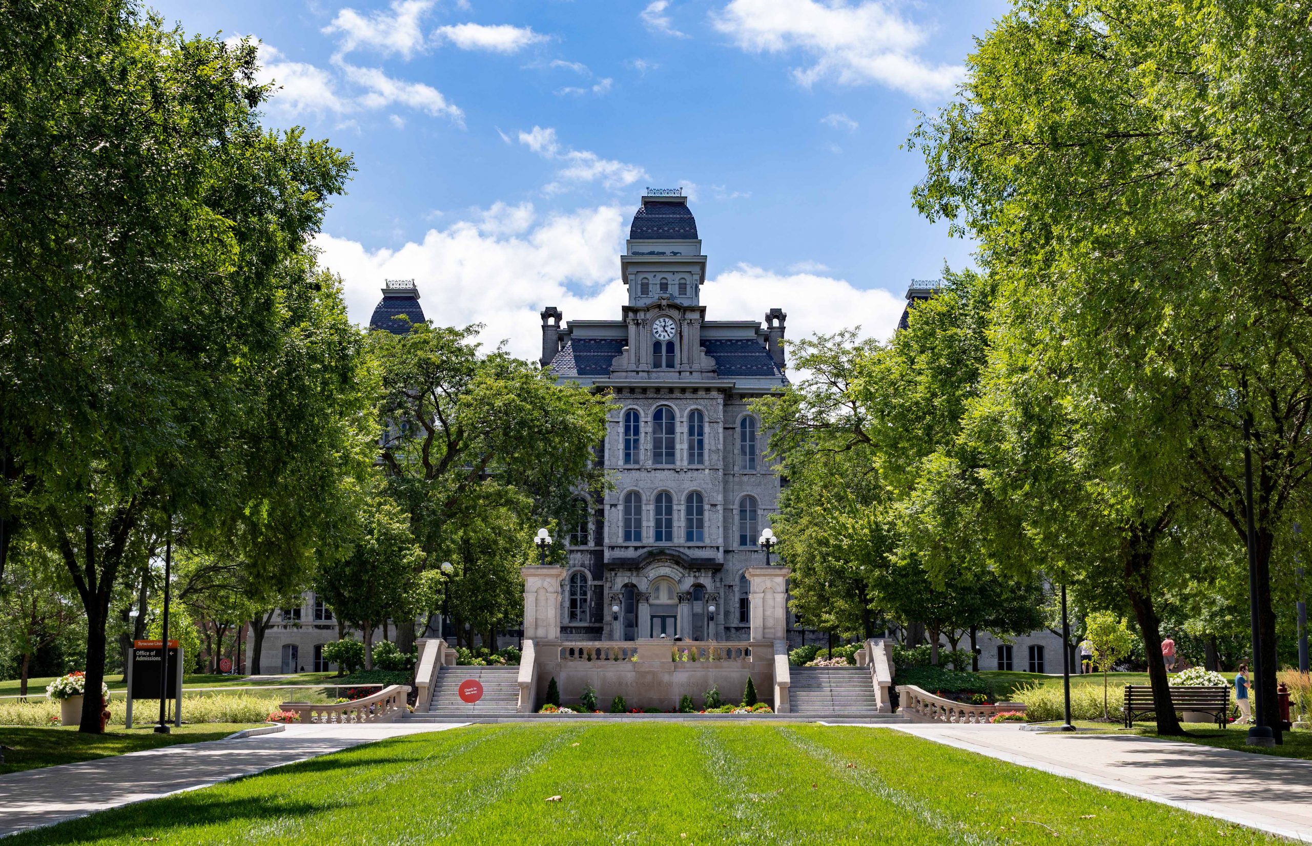 Hall of Languages on a sunny day with the grass and trees lining each side