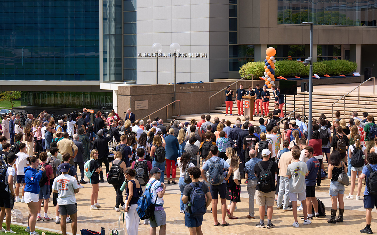 people gathered at the Newhouse Family Plaza