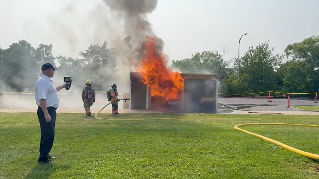 firefighters putting out a fire during a mock exercise