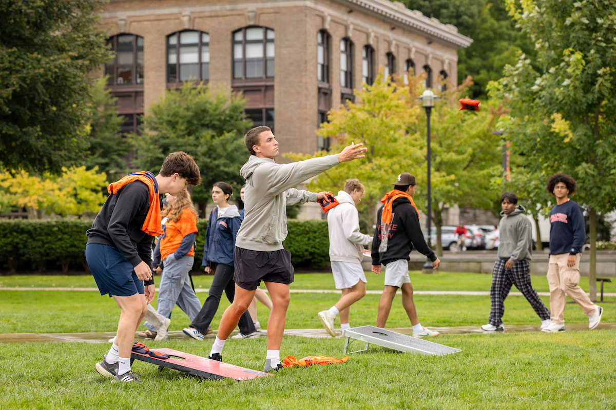 Students playing cornhole on the Quad. 
