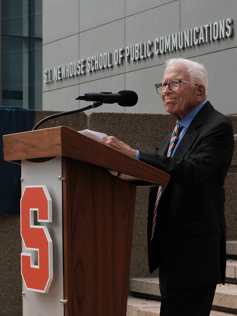 person standing at podium