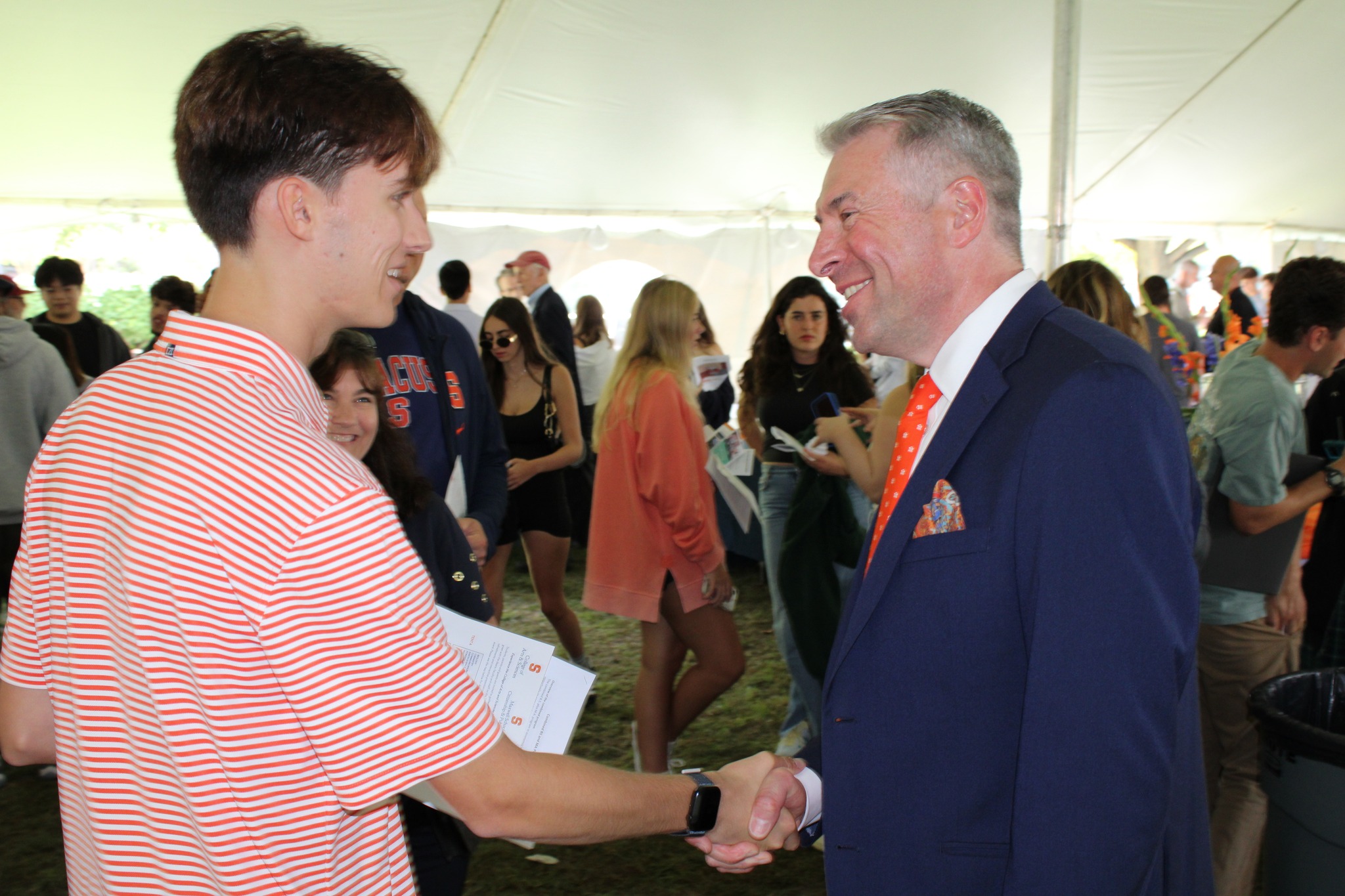 Two people shaking hands.