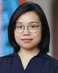young woman with glasses looking at camera