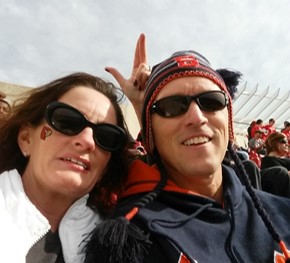 selfie of two people in Syracuse gear at a game