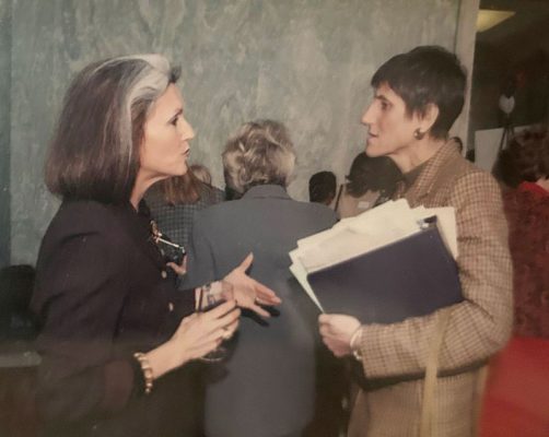 Phyllis Greenberger standing and talking with Connecticut Congresswoman Rosa Delauro at a political function