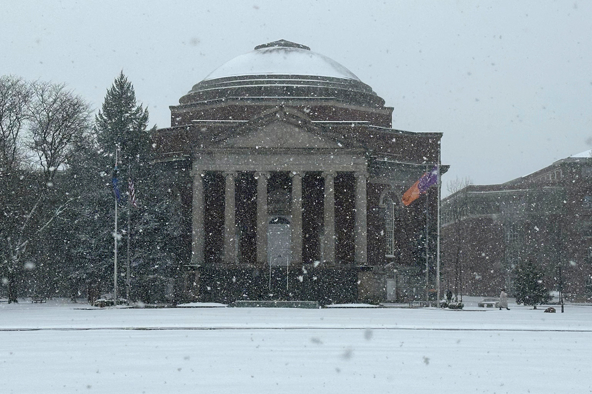 Snow falling on the Syracuse University campus