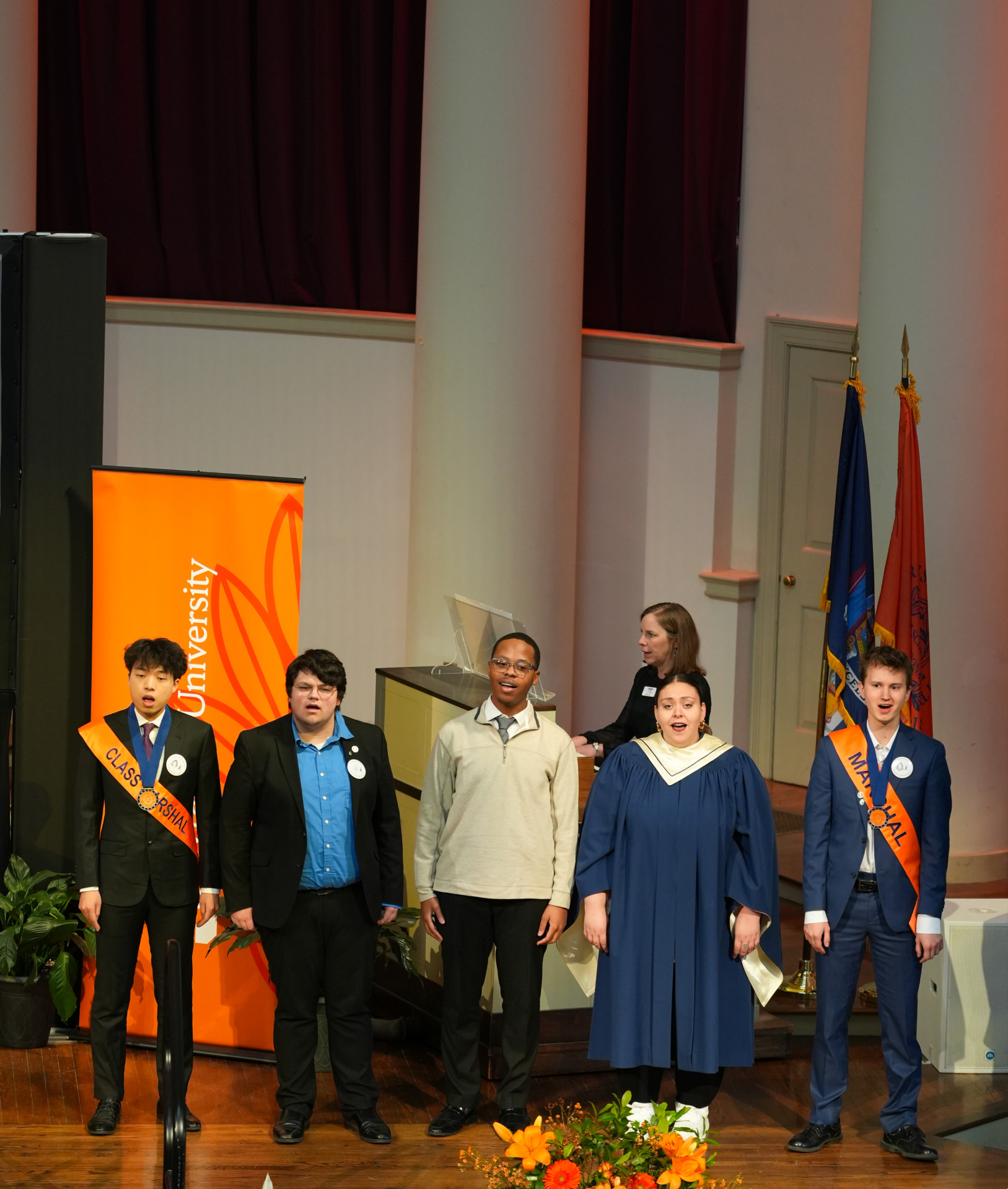 STudents sing the alma mater