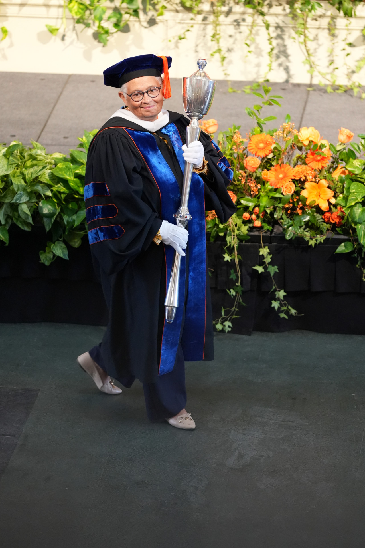 Bea Gonzalez with University's charter mace