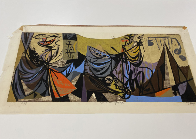 A woodcut press featuring abstract art with a mix of geometric shapes and fluid lines. The artwork features a variety of colors including yellow, orange, blue, black, and brown.